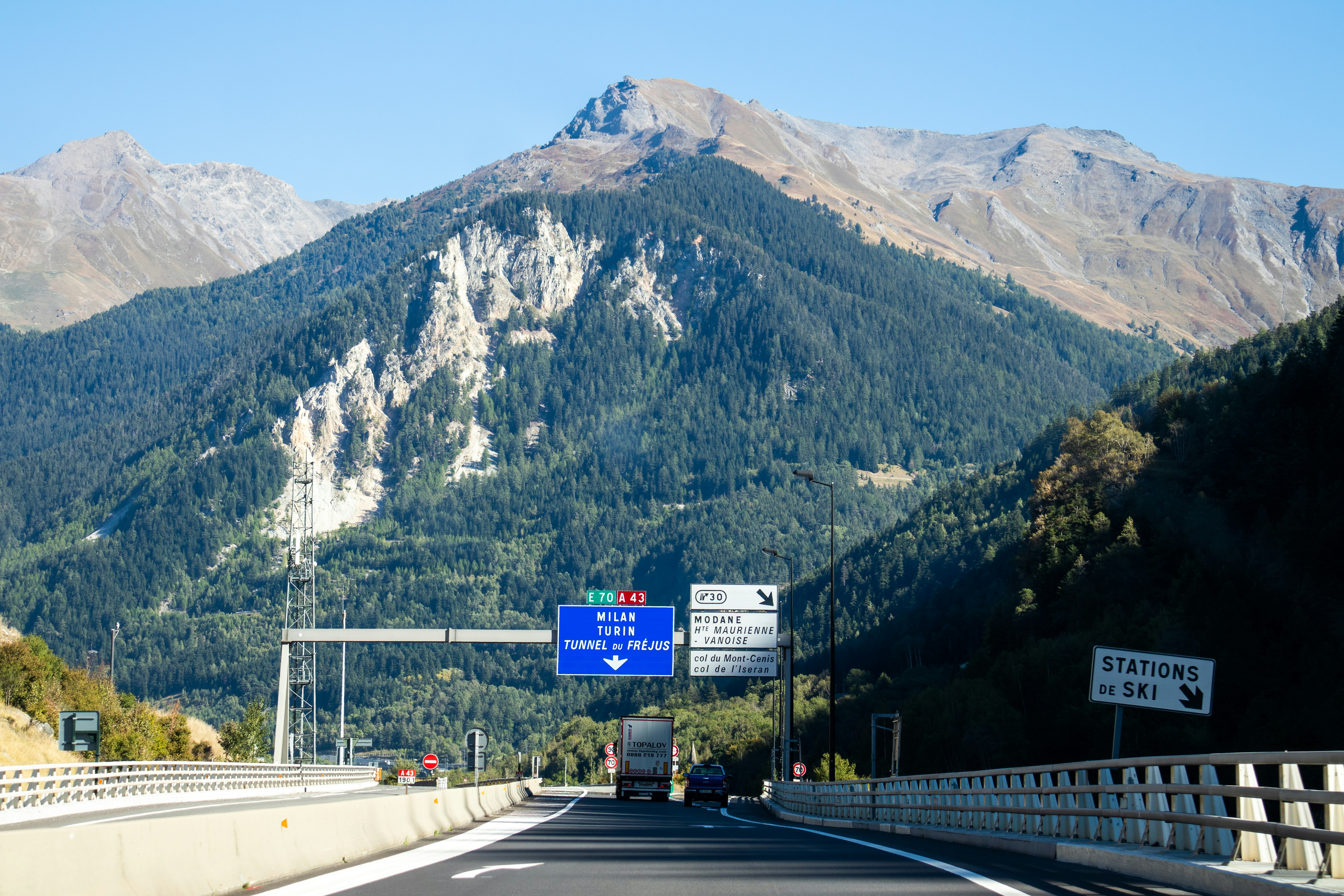 a highway with a mountain in the background